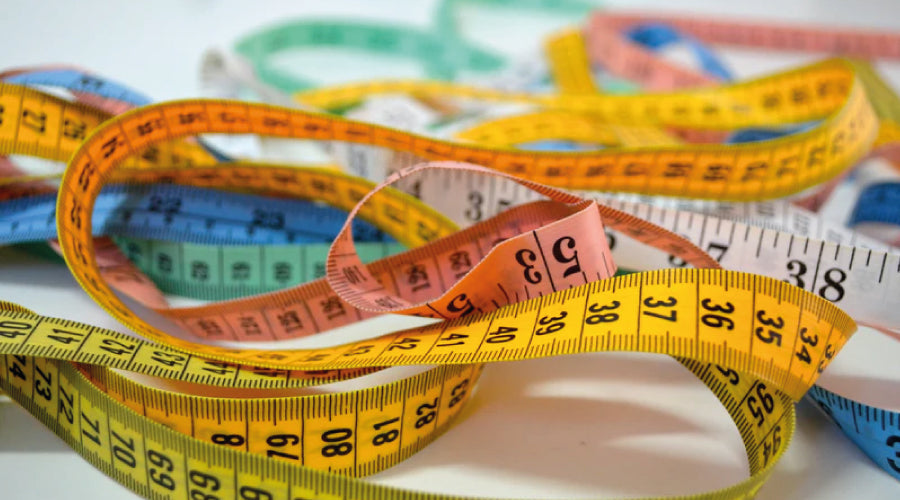 A bundle of coloured tape measures